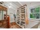 Well-stocked pantry with custom shelving and natural light through the window at 53 Born St, Norcross, GA 30071