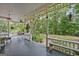 Spacious porch featuring classic railings, comfortable seating, and a view of the backyard at 53 Born St, Norcross, GA 30071