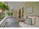 Inviting covered front porch with a swing and hanging plants perfect for relaxing outdoors at 53 Born St, Norcross, GA 30071