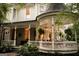 Exterior porch area featuring outdoor seating, hanging plants, and elegant architecture at 53 Born St, Norcross, GA 30071