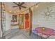 Comfortable porch with an outdoor table, ceiling fan, lighting, and home access at 53 Born St, Norcross, GA 30071