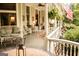 Spacious covered porch with comfortable seating and charming details, perfect for outdoor enjoyment at 53 Born St, Norcross, GA 30071