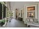 Relaxing porch with cozy seating, decorative windows, and views of the lush greenery at 53 Born St, Norcross, GA 30071