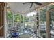 Screened porch with seating area and views to outdoors at 53 Born St, Norcross, GA 30071