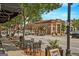 Quaint street view showcases a brick building with outdoor seating and blooming trees at 53 Born St, Norcross, GA 30071
