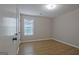 Bright bedroom with wood floors and large window at 470 Cornwallis Way, Fayetteville, GA 30214