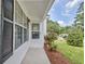 Welcoming entrance with black shutters, well-maintained landscaping, and a charming covered porch, perfect for relaxing at 470 Cornwallis Way, Fayetteville, GA 30214