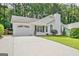 Inviting single-Gathering home with a paved driveway, attached garage and well-kept lawn surrounded by lush trees at 470 Cornwallis Way, Fayetteville, GA 30214