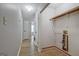 Hallway with wood-look floors leading to a laundry area with washer and dryer hookups at 470 Cornwallis Way, Fayetteville, GA 30214