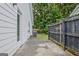 Patio with a wooden fence and a door to the house, next to an AC unit at 470 Cornwallis Way, Fayetteville, GA 30214