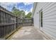 A view of the fenced-in patio with a door that leads to the home's interior at 470 Cornwallis Way, Fayetteville, GA 30214