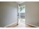 Room with light gray walls and wood-look floors, with a door leading to a patio at 470 Cornwallis Way, Fayetteville, GA 30214