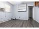 Modest bedroom featuring gray floors, a window with blinds, and storage at 1112 Mealor Rd, Lawrenceville, GA 30043