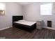 Bedroom features grey floors and walls and a minimalist design and window at 1112 Mealor Rd, Lawrenceville, GA 30043