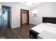 Bright bedroom showcasing open closet, grey flooring and a door leading to other room at 1112 Mealor Rd, Lawrenceville, GA 30043