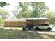 Exterior of single story brick home with car under carport and grill in back yard at 1112 Mealor Rd, Lawrenceville, GA 30043