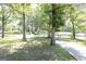 Well-maintained front yard with mature trees and a glimpse of the charming neighborhood at 1112 Mealor Rd, Lawrenceville, GA 30043