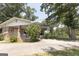 Charming brick home with mature landscaping, a covered porch, and a spacious driveway at 1112 Mealor Rd, Lawrenceville, GA 30043