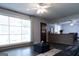 Cozy living room with large window for natural light, ceiling fan, and modern decor at 1112 Mealor Rd, Lawrenceville, GA 30043