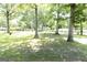 Spacious front yard with mature trees and views of the surrounding neighborhood at 1112 Mealor Rd, Lawrenceville, GA 30043