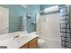 Bathroom featuring a vanity, toilet, and bathtub-shower combination with blue and white shower curtain at 377 Avian Forest Dr, Stockbridge, GA 30281