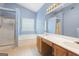 Bright bathroom featuring a soaking tub, separate shower, and double sink vanity with oak cabinets at 377 Avian Forest Dr, Stockbridge, GA 30281