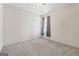 Bright bedroom with double closets and neutral carpet and paint at 377 Avian Forest Dr, Stockbridge, GA 30281