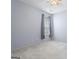 Bright bedroom featuring neutral carpet, light blue walls, and a window for natural light at 377 Avian Forest Dr, Stockbridge, GA 30281
