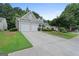 Charming home featuring a two-car garage, manicured lawn, and inviting curb appeal at 377 Avian Forest Dr, Stockbridge, GA 30281