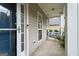 Covered front porch featuring a relaxing porch swing and neutral siding at 377 Avian Forest Dr, Stockbridge, GA 30281