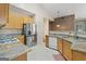 A kitchen featuring stainless steel refrigerator and granite countertops at 377 Avian Forest Dr, Stockbridge, GA 30281