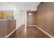 A dining room and living room area featuring wood flooring and a neutral color scheme at 377 Avian Forest Dr, Stockbridge, GA 30281