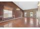 Spacious living room featuring hardwood floors and large windows for plenty of natural light at 377 Avian Forest Dr, Stockbridge, GA 30281