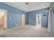 Primary bedroom featuring carpet flooring, ensuite bathroom and ample space at 377 Avian Forest Dr, Stockbridge, GA 30281