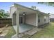 Covered patio with ceiling fan, sliding glass door access to home, and stone paver accents at 377 Avian Forest Dr, Stockbridge, GA 30281