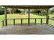 A backyard deck overlooks a large green lawn surrounded by trees at 51 Estates Dr, Villa Rica, GA 30180
