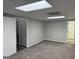Spacious basement with gray walls, commercial ceiling, and multiple doors at 51 Estates Dr, Villa Rica, GA 30180