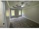 Open Primary bedroom with tray ceilings and lots of natural light, perfect for relaxation at 51 Estates Dr, Villa Rica, GA 30180