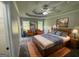 A staged bedroom with a bed, two chairs, artwork and great natural light at 51 Estates Dr, Villa Rica, GA 30180