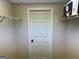 A walk-in closet with white wire shelving and a centered door at 51 Estates Dr, Villa Rica, GA 30180
