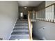 Inviting foyer features a staircase leading to the upper level, with neutral walls and elegant finishes at 51 Estates Dr, Villa Rica, GA 30180