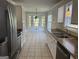 Well-appointed kitchen featuring stainless steel appliances, tile flooring, ample cabinet space, and breakfast nook at 51 Estates Dr, Villa Rica, GA 30180