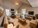 Spacious living room featuring vaulted ceilings, a fireplace, and comfortable seating arrangement at 51 Estates Dr, Villa Rica, GA 30180