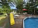 Above ground pool with deck, slide, and patio furniture at 51 Estates Dr, Villa Rica, GA 30180