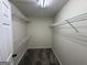 Walk-in closet with metal shelving that provides a practical storage solution at 51 Estates Dr, Villa Rica, GA 30180