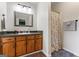 Simple bathroom with vanity and shower featuring a patterned shower curtain at 200 Pine Tree Ln, Mcdonough, GA 30252