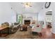 Spacious living room with a fireplace, plush seating, hardwood floors, and an open layout at 200 Pine Tree Ln, Mcdonough, GA 30252