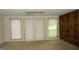 Spacious basement featuring built-in shelving and double doors to the outside at 3336 Harvester Woods Rd, Decatur, GA 30034