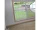 Bedroom window view, framed by light trim, lets in plenty of natural light at 3336 Harvester Woods Rd, Decatur, GA 30034