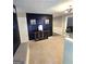 Stylish entryway with dark accent wall, modern lighting, and wood console table at 10178 Top Tree Ct, Jonesboro, GA 30238